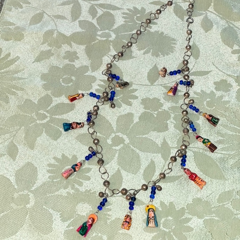 Nativity scene necklace and is 25 inches in length.